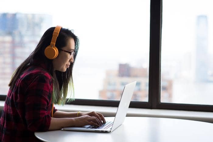 professional writer woman writing on laptop